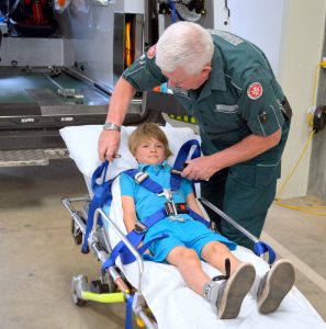 Strapped In: Jazz Morwitzer (Yr 4) tested out the ambulance stretcher at St John Ambulance  sub centre. 