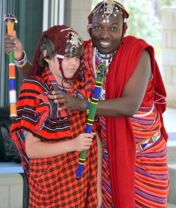 Tribal: Maasai Warrior, Felix  Mollel assisted Yr 5 student, Jett to don the Maasai costume. 