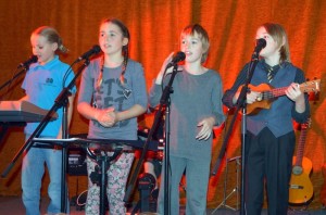 Rockin’Out:  Loudmouth’s  Amelia Glass, Mia Coleman, Hunter and Rio Haigh. on stage. 