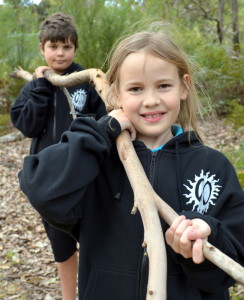 Back to nature MRIS students Jett Higgins (Yr 6) and Amelia Glass(Yr 5) start collecting suitable material to build cubbies in the school grounds. 