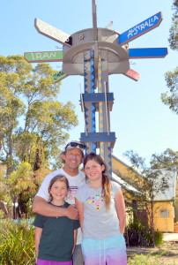 MRIS Clan: Mark Heussenstamm with granddaughters, Kirra and Araya welcome the school’s fabulous new signpost. 