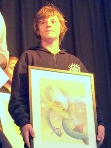 Jarra Mills, Year 6 with his framed artwork.