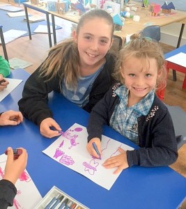 FUN: Mia Coleman and Eva McFie enjoyed colouring-in while  Oceana Syred and Rose Marchesani took part in CHAT club with MRIS parent, Julia Knight. 