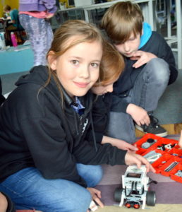 Yr 6 student, Amelia Glass with one of the MRIS robots. 